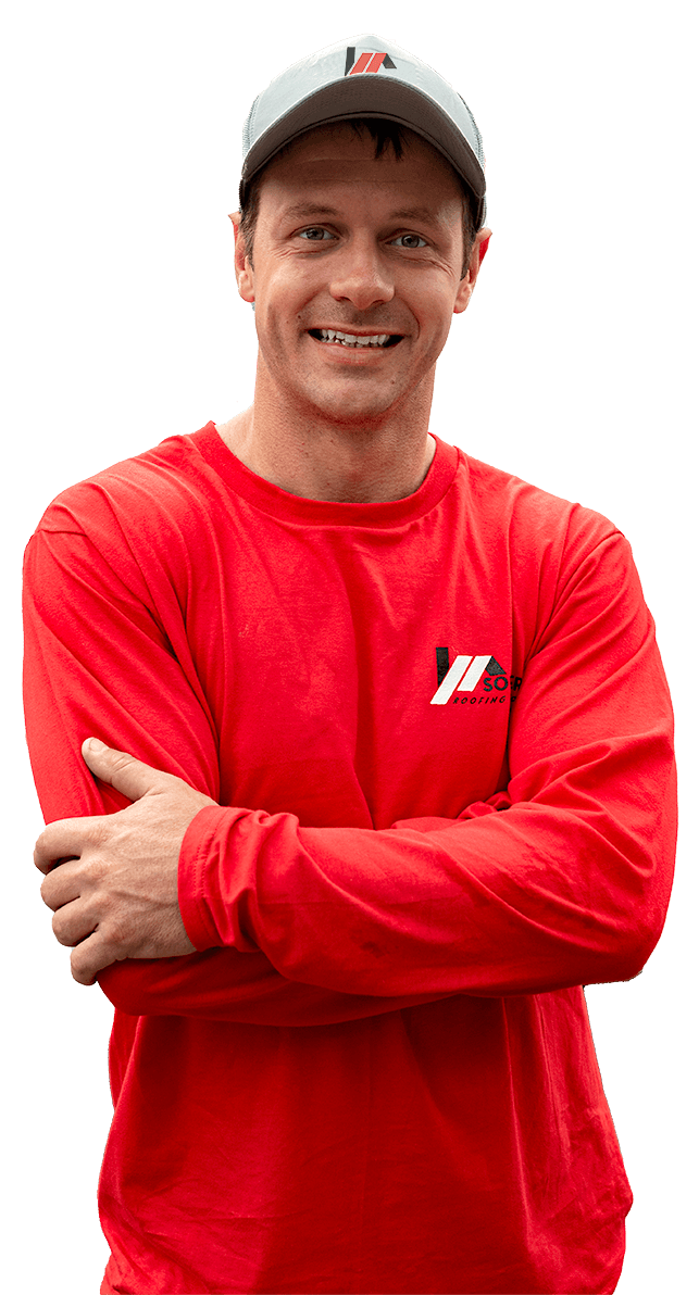 Ray Martinez – Owner, Southern Roofing Solutions Ray Martinez, owner of Southern Roofing Solutions, smiling with arms crossed in a red company shirt and cap