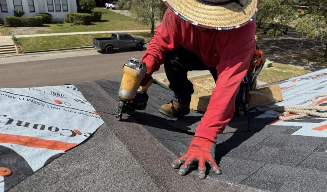 SRS_0027 Silsbee Southern Roofing Solutions expert installing high-quality asphalt shingles on a residential roof in Silsbee, Texas, ensuring superior protection and long-lasting durability.
